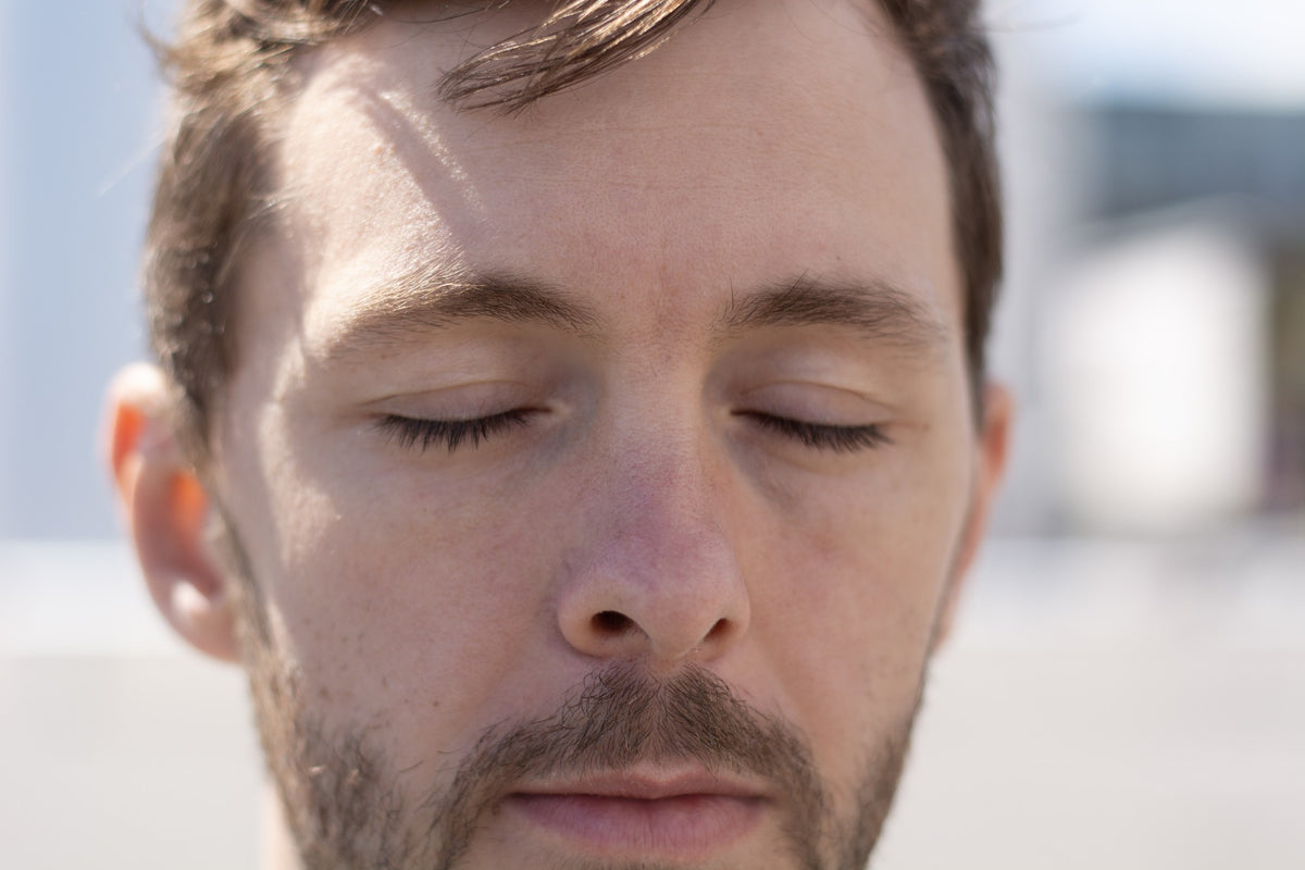 Portrait in daylight, eyes closed